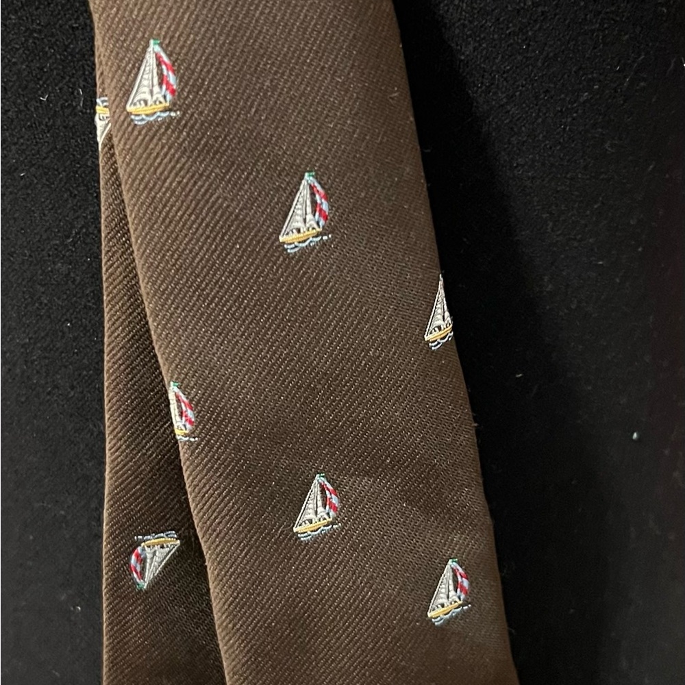 Sailboat neck tie. Boats are all over tie with  classic brown background.